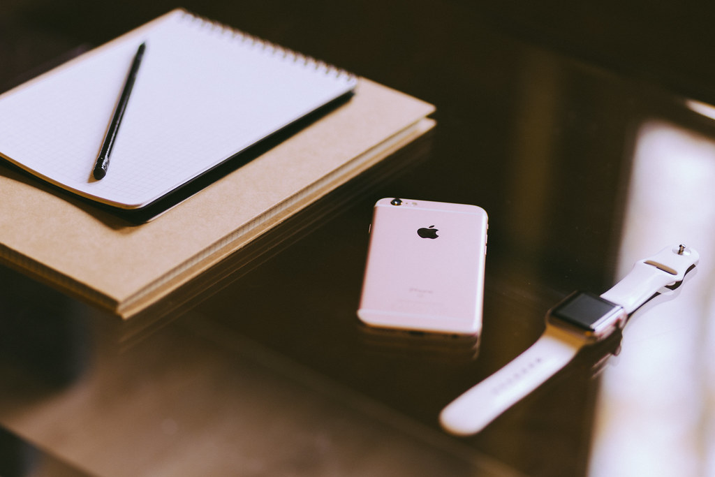Phone, watch, notebook, and everyday accessories